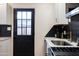 Updated kitchen featuring black backsplash, stainless appliances, and bright white cabinetry at 5106 N 17Th Ave # 3, Phoenix, AZ 85015