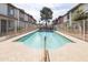 Inviting community pool enclosed by a white fence, perfect for relaxation and recreation at 5106 N 17Th Ave # 3, Phoenix, AZ 85015