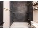 Beautifully tiled shower with gold hardware and convenient built-in shelving at 5106 N 17Th Ave # 3, Phoenix, AZ 85015