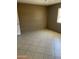 Bedroom featuring tile flooring, neutral paint, and a window offering ample natural light at 5114 W Joan De Arc Ave, Glendale, AZ 85304