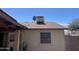 Home exterior featuring a central air unit, and tan stucco siding at 5114 W Joan De Arc Ave, Glendale, AZ 85304