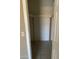 Practical walk-in closet featuring neutral colors and a sturdy hanging rod for organized storage solutions at 5114 W Joan De Arc Ave, Glendale, AZ 85304