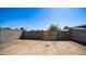 Backyard featuring a block wall with a wooden gate at 5327 W Saint Moritz Ln, Glendale, AZ 85306