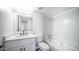 This bathroom features a tiled shower-tub combo with a single sink and a white cabinet at 5327 W Saint Moritz Ln, Glendale, AZ 85306