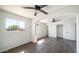 This bedroom features hardwood floors, bright windows, and two ceiling fans at 5327 W Saint Moritz Ln, Glendale, AZ 85306