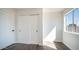 This bedroom features wood floors, a bright window, and a closet with sliding doors at 5327 W Saint Moritz Ln, Glendale, AZ 85306