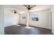 This bedroom offers hardwood floors, two ceiling fans, and well-lit windows at 5327 W Saint Moritz Ln, Glendale, AZ 85306