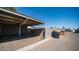 View of carport with shade and access to a gated area at 5327 W Saint Moritz Ln, Glendale, AZ 85306