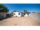 Rear exterior view of the home with a gravel area and storage shed at 5327 W Saint Moritz Ln, Glendale, AZ 85306