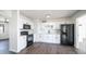 Modern kitchen featuring sleek white cabinets and stainless steel appliances at 5327 W Saint Moritz Ln, Glendale, AZ 85306