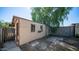 View of the backyard shed with windows and an air conditioner at 5327 W Saint Moritz Ln, Glendale, AZ 85306