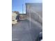 View of the home's shaded carport area, providing covered parking and access to the backyard at 6617 W Peck Dr, Glendale, AZ 85301