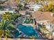 Beautiful aerial view of backyard oasis with pool, spa, outdoor kitchen, and pergola lounge area at 6704 N 10Th Pl, Phoenix, AZ 85014