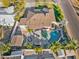 Stunning aerial view of a home with pool, outdoor kitchen, fire pit, and manicured landscaping at 6704 N 10Th Pl, Phoenix, AZ 85014