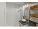 Stylish bathroom features a tiled shower over the tub and modern vanity with nice lighting at 6704 N 10Th Pl, Phoenix, AZ 85014