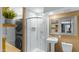 Contemporary bathroom with a sleek shower, floating vanity, and stacked washer/dryer at 6704 N 10Th Pl, Phoenix, AZ 85014