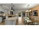 Bright and airy kitchen with stone countertops, stainless steel appliances, and a dining area at 6704 N 10Th Pl, Phoenix, AZ 85014