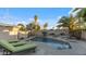 Beautiful backyard pool area with tropical landscaping and comfortable lounge chairs at 6704 N 10Th Pl, Phoenix, AZ 85014