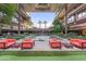 Courtyard seating area with water feature surrounded by trees and multi-story buildings at 7127 E Rancho Vista Dr # 2003, Scottsdale, AZ 85251