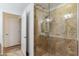 Luxurious shower with travertine walls and glass door at 7127 E Rancho Vista Dr # 2003, Scottsdale, AZ 85251