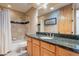 Bathroom featuring a bathtub, shower, and double sinks with granite countertops at 7211 E Rising Star Way, Carefree, AZ 85377