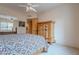 Bedroom featuring wooden furniture, mirror closet door, and a ceiling fan at 7211 E Rising Star Way, Carefree, AZ 85377