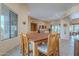 Inviting dining room featuring a wooden table, comfortable seating, and stone tile floors, perfect for entertaining guests at 7211 E Rising Star Way, Carefree, AZ 85377