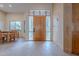 Inviting foyer with stone floors and a decorative wood door at 7211 E Rising Star Way, Carefree, AZ 85377