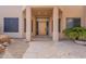 Covered front entry with stone walkway and desert landscaping at 7211 E Rising Star Way, Carefree, AZ 85377