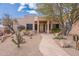 Inviting home with a stone pathway, desert landscaping, and a prominent front entrance at 7211 E Rising Star Way, Carefree, AZ 85377