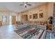 Spacious living room with a colorful rug and ample seating at 7211 E Rising Star Way, Carefree, AZ 85377