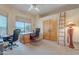 Bright office space with desert views, built-in desk, and natural light at 7211 E Rising Star Way, Carefree, AZ 85377