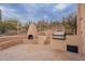 Backyard with a built-in outdoor kitchen and cozy fireplace perfect for entertaining at 7211 E Rising Star Way, Carefree, AZ 85377