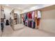 Walk-in closet with ample hanging space, shelving, and full-length mirror at 7211 E Rising Star Way, Carefree, AZ 85377