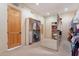 Walk-in closet featuring shelving units, storage, and a full length mirror at 7211 E Rising Star Way, Carefree, AZ 85377