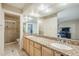 Bathroom featuring dual sinks with granite countertops and a separate shower, providing luxury and convenience at 7629 N Via De La Campana --, Scottsdale, AZ 85258