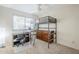 Functional bedroom with a lofted bed, desk, and dresser, providing ample space for work and relaxation at 7629 N Via De La Campana --, Scottsdale, AZ 85258