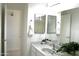 Bathroom featuring a sink with modern fixtures, towels, and a well lit mirror at 7910 E Snowdon Cir, Mesa, AZ 85207