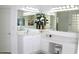 Bright bathroom with dual sink vanity, large mirror, and neutral countertops provides a spa-like feel at 7910 E Snowdon Cir, Mesa, AZ 85207