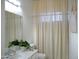 Bathroom featuring a sink and toilet with modern fixtures and a coordinated shower curtain at 7910 E Snowdon Cir, Mesa, AZ 85207