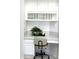 Cozy desk area featuring built-in shelving, a comfortable chair, and natural lighting at 7910 E Snowdon Cir, Mesa, AZ 85207