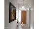 Inviting entryway with tile flooring, a decorative chandelier, and natural light at 7910 E Snowdon Cir, Mesa, AZ 85207