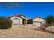 Charming single-story home with desert landscaping and a tile roof under a clear blue sky at 7910 E Snowdon Cir, Mesa, AZ 85207