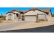 Single-story home with a tile roof, neutral colors, and easy to maintain desert landscaping at 7910 E Snowdon Cir, Mesa, AZ 85207