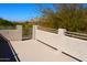 Spacious outdoor patio overlooking trees and mountains in the distance at 7910 E Snowdon Cir, Mesa, AZ 85207