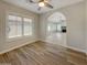 Open-concept living space with hardwood floors and great natural light at 8661 N 108Th Ln, Peoria, AZ 85345