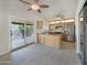 Spacious kitchen features stainless steel appliances, light wood cabinetry, and an adjacent dining area at 8661 N 108Th Ln, Peoria, AZ 85345