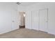 Bright bedroom with carpet flooring and double door closet at 9121 W Alvarado St, Phoenix, AZ 85037