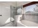 A pristine bathroom features a soaking tub and glass-enclosed shower at 9853 W Irma Ln, Peoria, AZ 85382