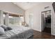 Serene main bedroom with a vaulted ceiling, a walk-in closet, a bay window, and an ensuite bathroom at 9853 W Irma Ln, Peoria, AZ 85382